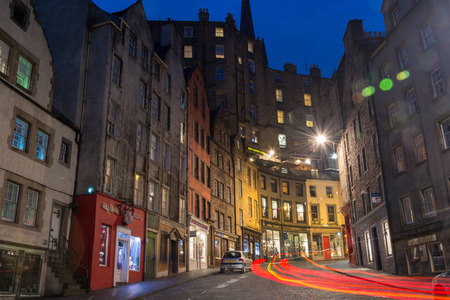 EDINBURGH, SCOTLAND - September 25, 2017: Lit Victoria street during the night with red light trails from carsのeditorial素材