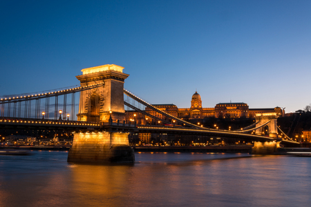 The Chain Bridge with the Royal Palace in the background in Budapest during the blue hourのeditorial素材