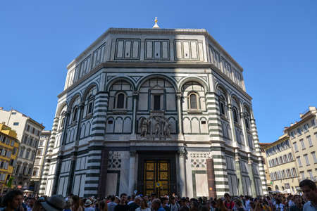 FLORENCE, ITALY - August 19, 2019: The baptistery of San Giovanni with the cathedral in Florence on a sunny dayのeditorial素材