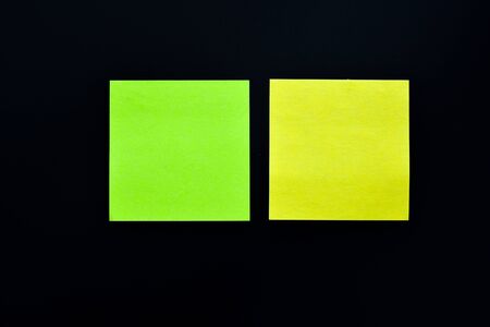 Two post its on a black backgroundの写真素材