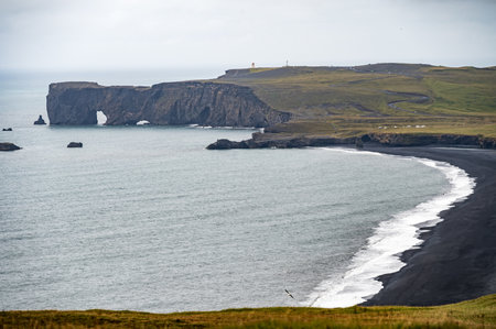 The coastline and black beach near Vik in Iceland with rock formations