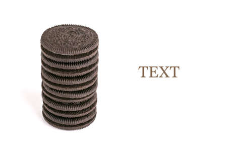 Vertical double chocolate chip cookie sandwich on white isolated background. Free space for textの写真素材