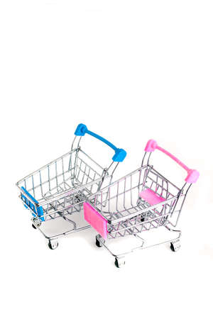 Two shopping basket blue and pink on white background with copy spaceの写真素材