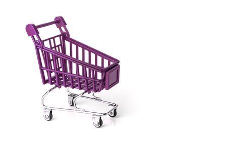 Pink Shopping cart isolated on white background. Shopping basket on white backgroundの写真素材