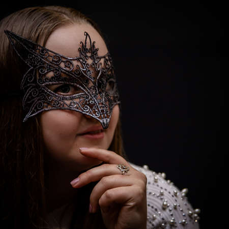 Sexy woman in an openwork mask of black color. Seductive girlのeditorial素材