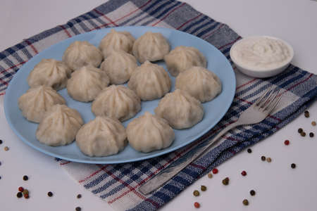 Khinkali with meat.National Georgian cuisine. Sour creamの写真素材