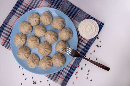 Khinkali with meat.National Georgian cuisine. Sour creamの写真素材