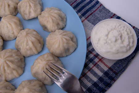 National Georgian cuisine. Khinkali with meat. Khinkali on a plate close-upの写真素材