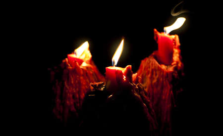 Burning candles in the darkの写真素材