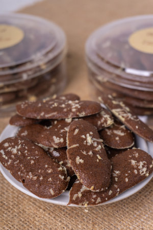 cookies with chocolate chips on a plate on a burlap backgroundの写真素材