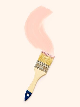 Brushes with pink paint isolated on pink backgroundの写真素材