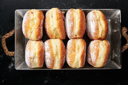 Sufganiyot donuts with jelly on black backgroundの写真素材