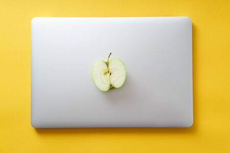 Overhead flatlay image with notebook and healthy snacks on colorful background. Modern lifestyle conceptの写真素材
