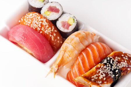 Creative layout with various sushi on white background. Shrimp, eel, salmon and tunaの写真素材