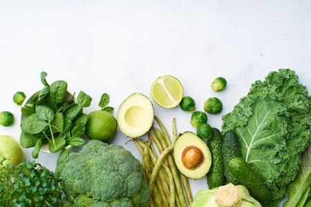 Creative flat lay with healthy vegetarian meal ingredients. Raw food concept. A variety of organic fruits and vegetables with avocado. Vegan menuの写真素材