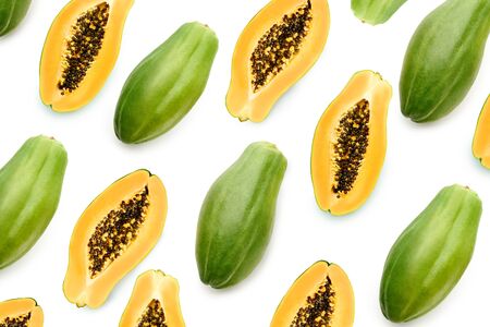 Creative layout papaya pattern isolated on white background. Tropical food top viewの写真素材