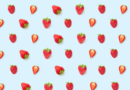 Pattern with fresh ripe red strawberries isolated on blue background