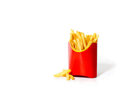 Fried potatoes isolated on white background. French fries with copy space. Junk food