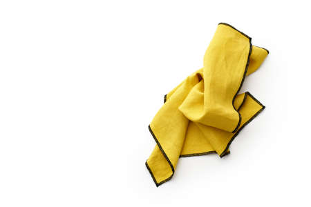 Flat lay with yellow linen kitchen napkin isolated on white background. Folded cloth for mockup with copy spaceの写真素材