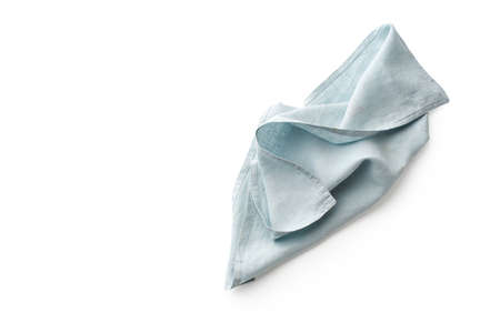 Flat lay with blue linen rustic kitchen napkin isolated on white background. Overhead image of folded cloth for mockup, copy spaceの写真素材