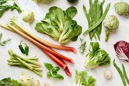Fresh raw artichokes halved and ready for cooking. Top view healthy vegetarian food conceptの写真素材