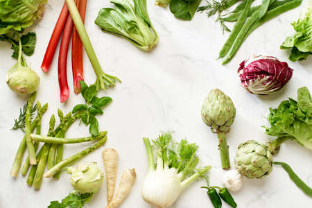 Fresh raw artichokes halved and ready for cooking. Top view healthy vegetarian food conceptの写真素材