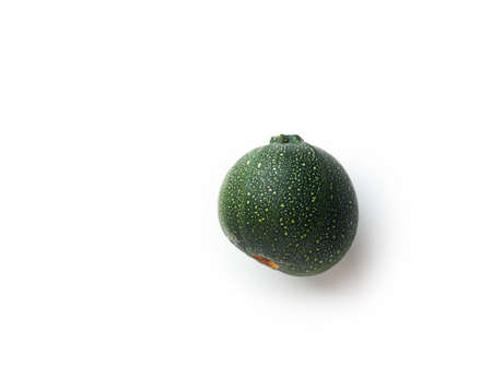 Fresh green round courgette isolated on white background. Ball-shaped zucchini top viewの写真素材