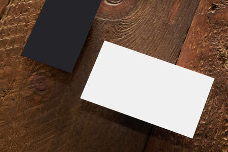 Modern business card mockup template on gray background. Top view flat lay of a card. Mock-up design for branding, advertising and designの写真素材