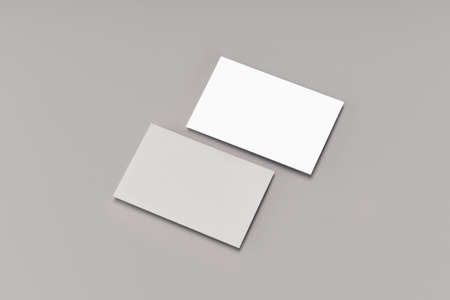 Modern business card mockup template on gray background. Top view flat lay of a card. Mock-up design for branding, advertising and designの写真素材