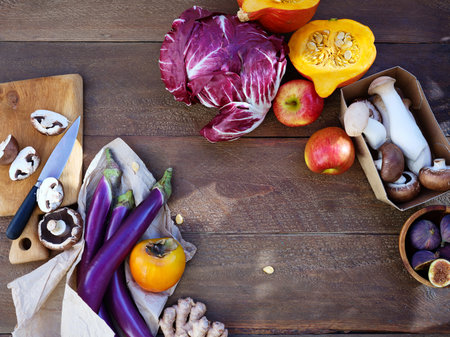 Flat lay seasonal vegetables, fruits and bread, healthy vegetarian ingredients. Grilled aubergines and mushroomsの写真素材