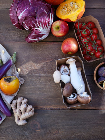 Flat lay seasonal vegetables, fruits and bread, healthy vegetarian ingredients. Grilled aubergines and mushroomsの写真素材