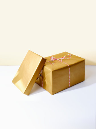 Holiday gifts in golden wrapping paperの写真素材