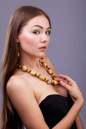 Portrait of beautiful sensual woman with elegant hairstyle.  Perfect makeup. Brunette girl. Fashion photoの写真素材