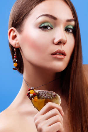Portrait of beautiful sensual woman with elegant hairstyle.  Perfect makeup. Brunette girl. Fashion photoの写真素材