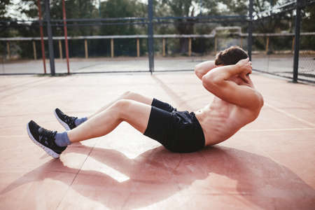 sport day guy pushed his torso on the site free outdoor summerの写真素材