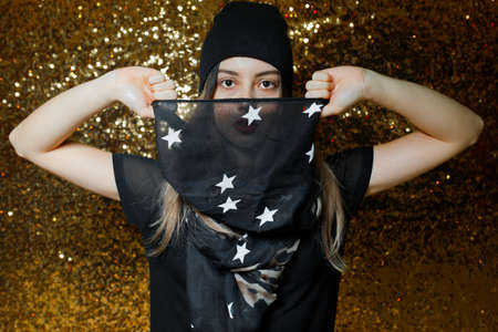 women dressed black having fun in night clubs photographed on gold background girl have black scarf...