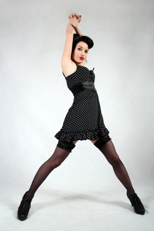 Pin up girl all in black with nice stockingsの写真素材