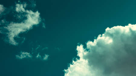 cyan sky with round cloud in the cornerの写真素材