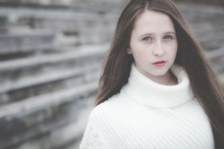 portrait of a beautiful young sad girl  outdoors at the day timeの写真素材