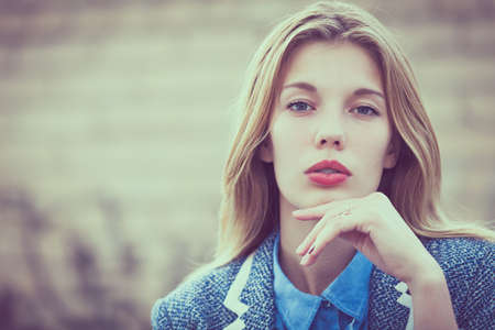 portrait of a beautiful young  girl  outdoors at the day timeの写真素材