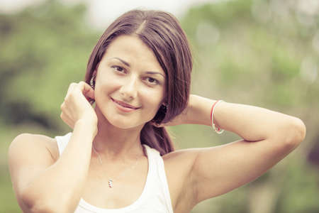 portrait of a beautiful brunette girl outdoor at the day time