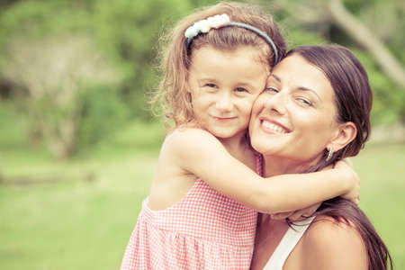 Happy mother and daughter playing in the park at the day time. Concept of celebration Mothers day .の写真素材
