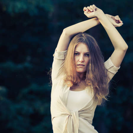 Trendy Hipster Girl Relaxing on the road at the day time. Concept of Modern Youth Lifestyle .の写真素材