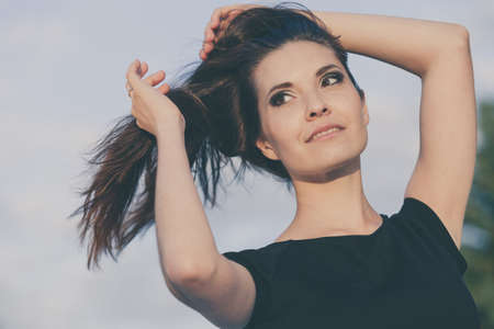 portrait of a beautiful young  girl  outdoors at the day timeの写真素材