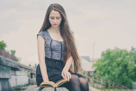 portrait of a beautiful young  girl  outdoors at the day timeの写真素材