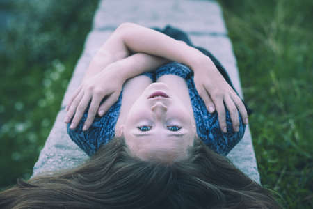 portrait of a beautiful young  girl  outdoors at the day timeの写真素材