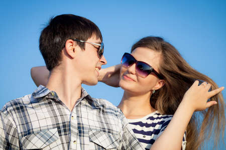 Portrait of young couple standing  in a field. Concept of beautiful couple in love.の写真素材