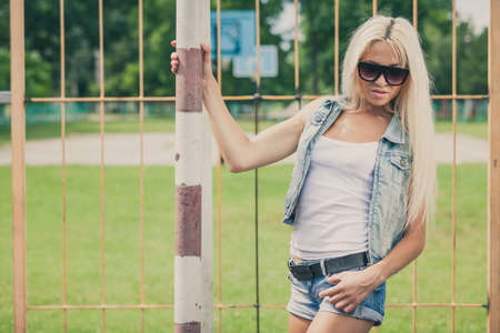 Sports girl standing outdoors at the day time. Concept of healthy life.の写真素材