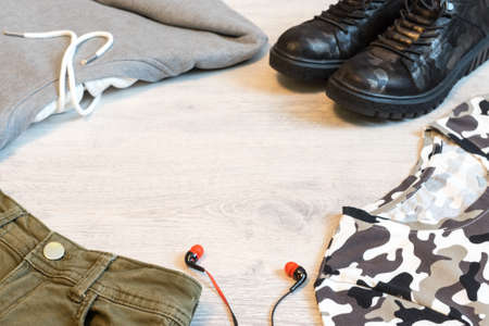Teen clothing set: grey sweatshirt, green shorts, t-short and boots in military style