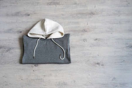 Grey sweatshirt on light background